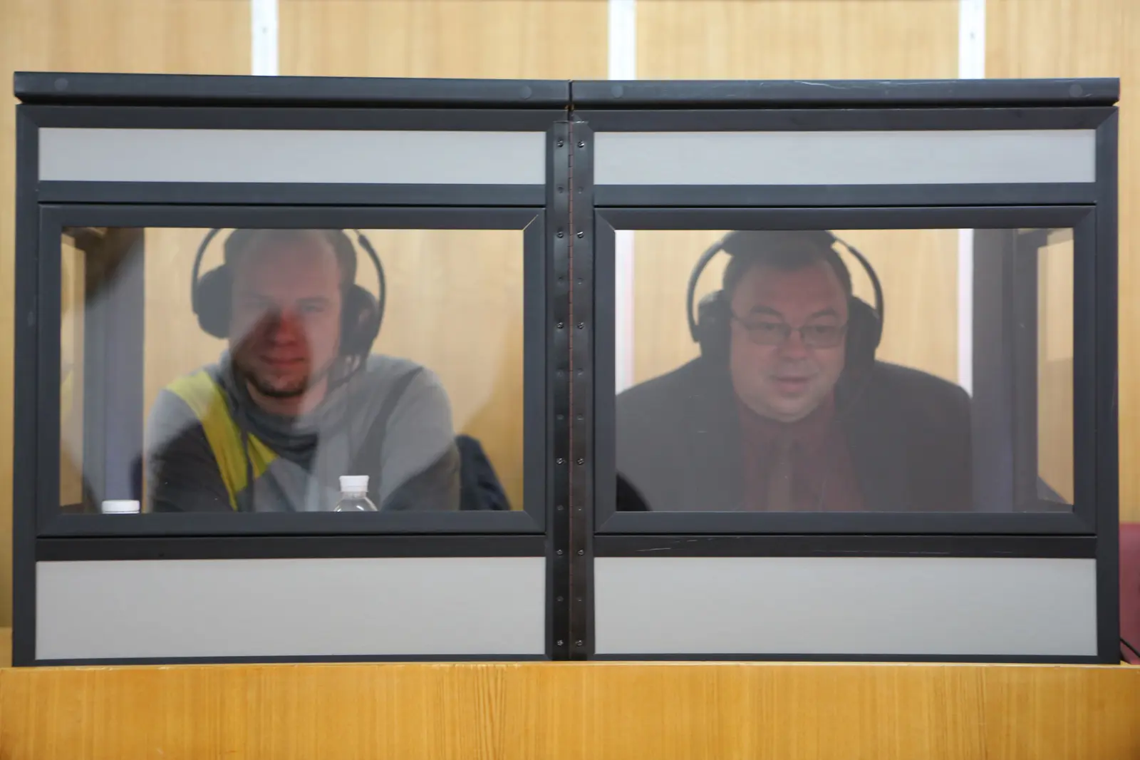 Two interpreters in a soundproof booth